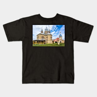 Orthodox Church against bright blue sky Kids T-Shirt